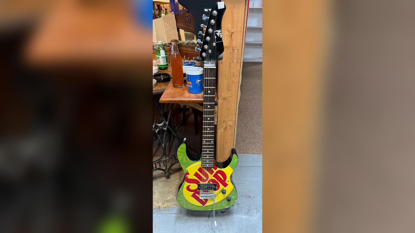 Where Should You Buy Studio Gear? Try Antique Stores and Thrift Shops — A $35 Sun Drop promo guitar in an antique booth is…