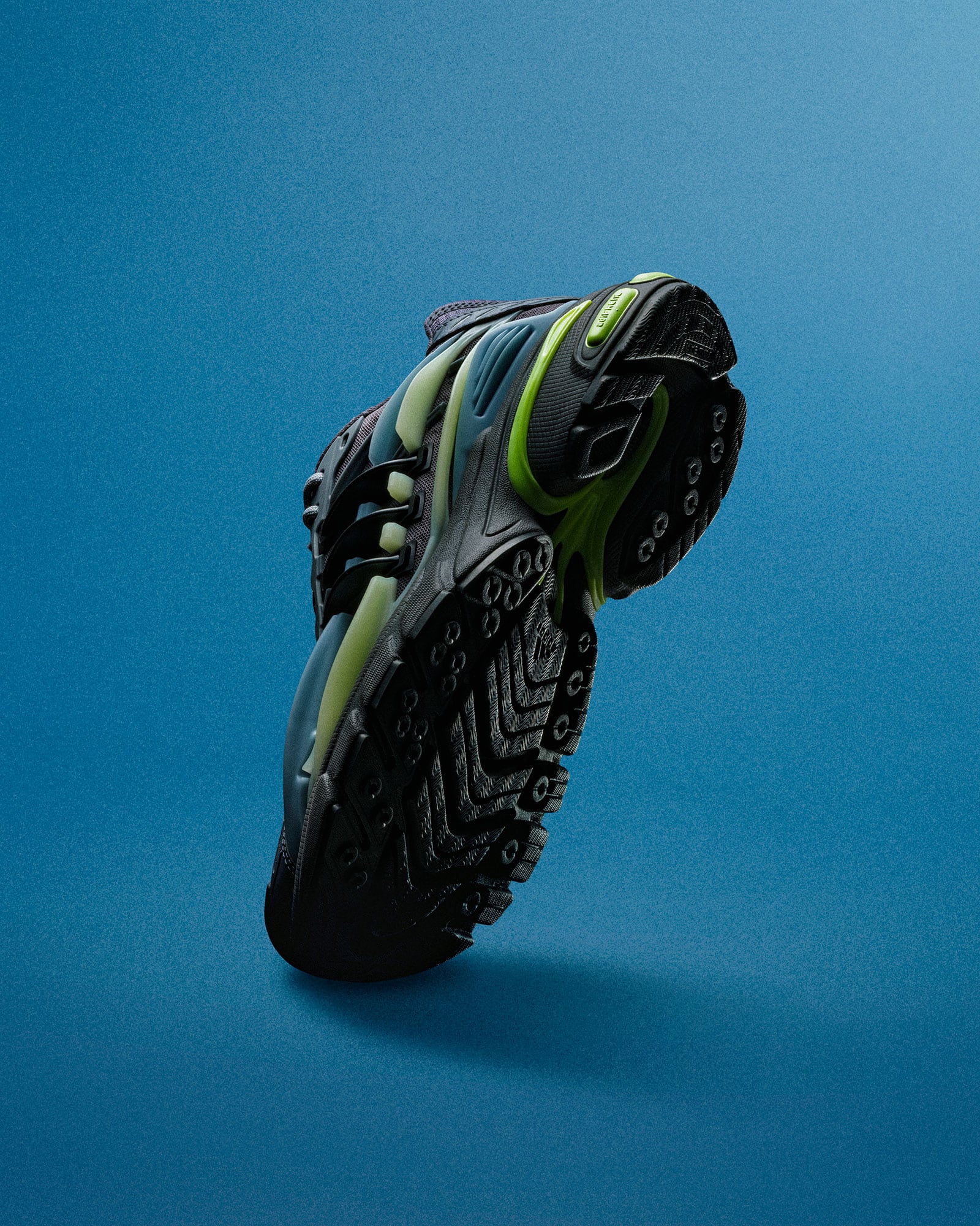 The Storm adidas VIRGINIA Adistar Jellyfish sneaker photographed against a blue background, showing its sculptural sole and cage.